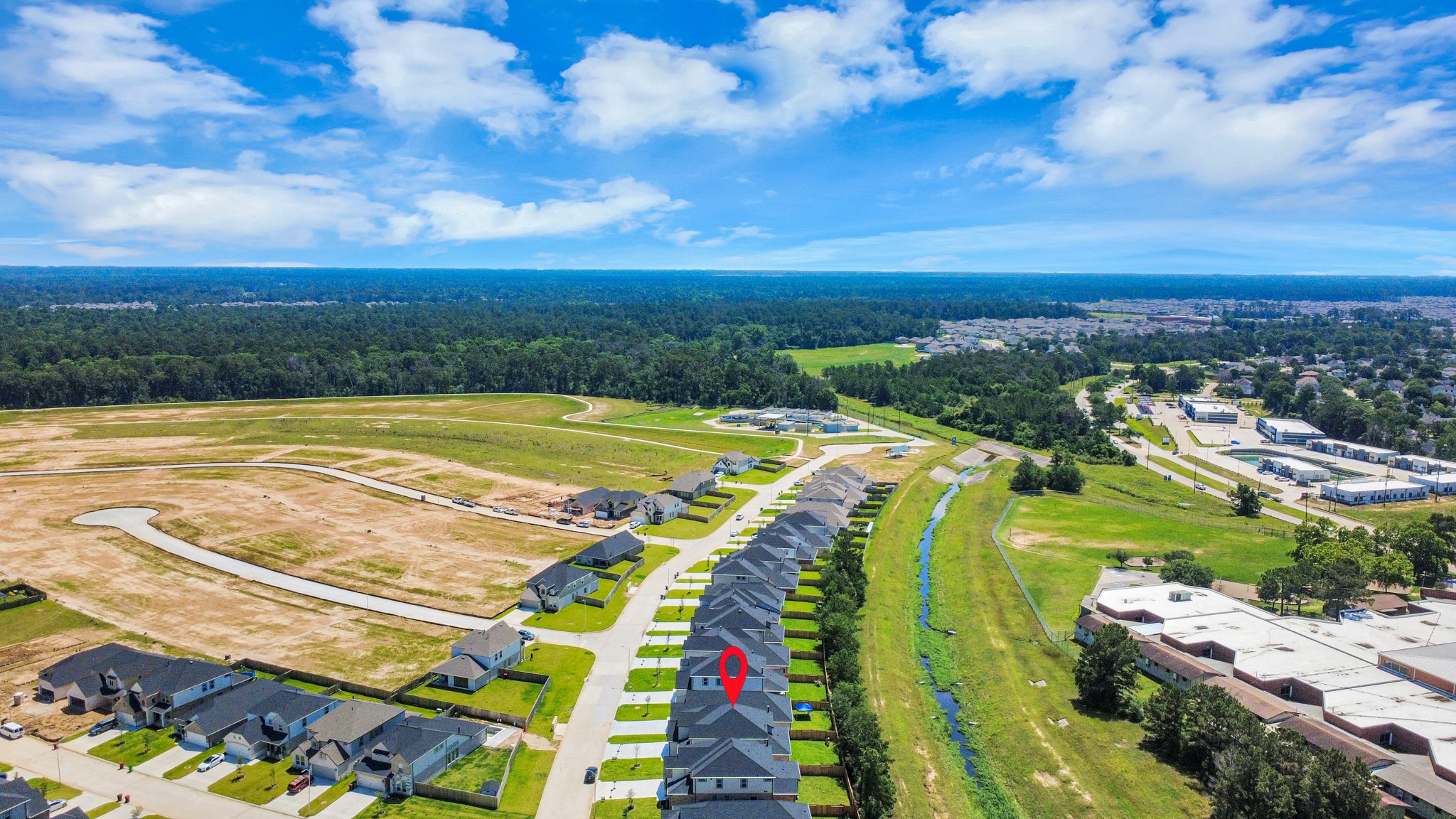 2926 Bury Park Dr Spring Spring, TX 77373 - Photo 4 of 40 An aerial view of a spacious subdivision lot, highlighting a well-maintained yard and a fully fenced perimeter, offering both privacy and expansive outdoor space.