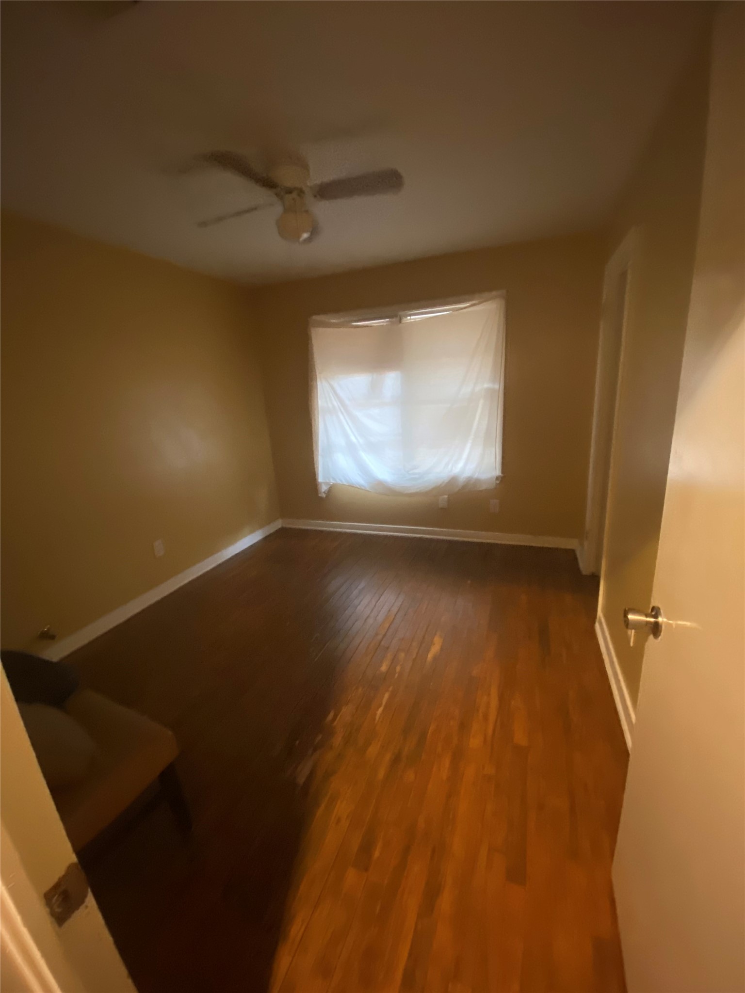 2504 Pennington Street Houston, TX 77093 - Photo 4 of 9 en empty room with wooden floor and windows