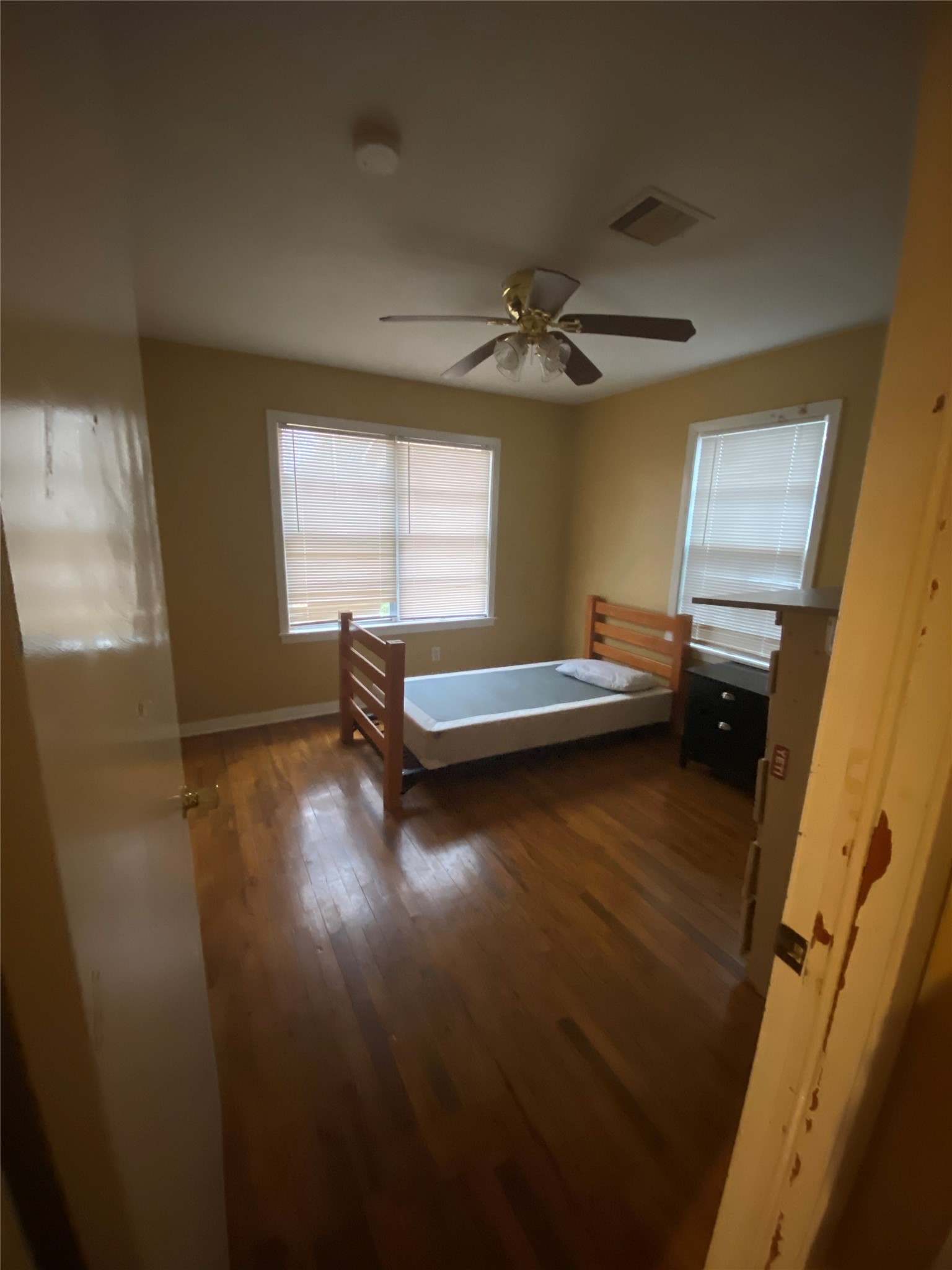 2504 Pennington Street Houston, TX 77093 - Photo 5 of 9 a living room with a bed furniture and a window