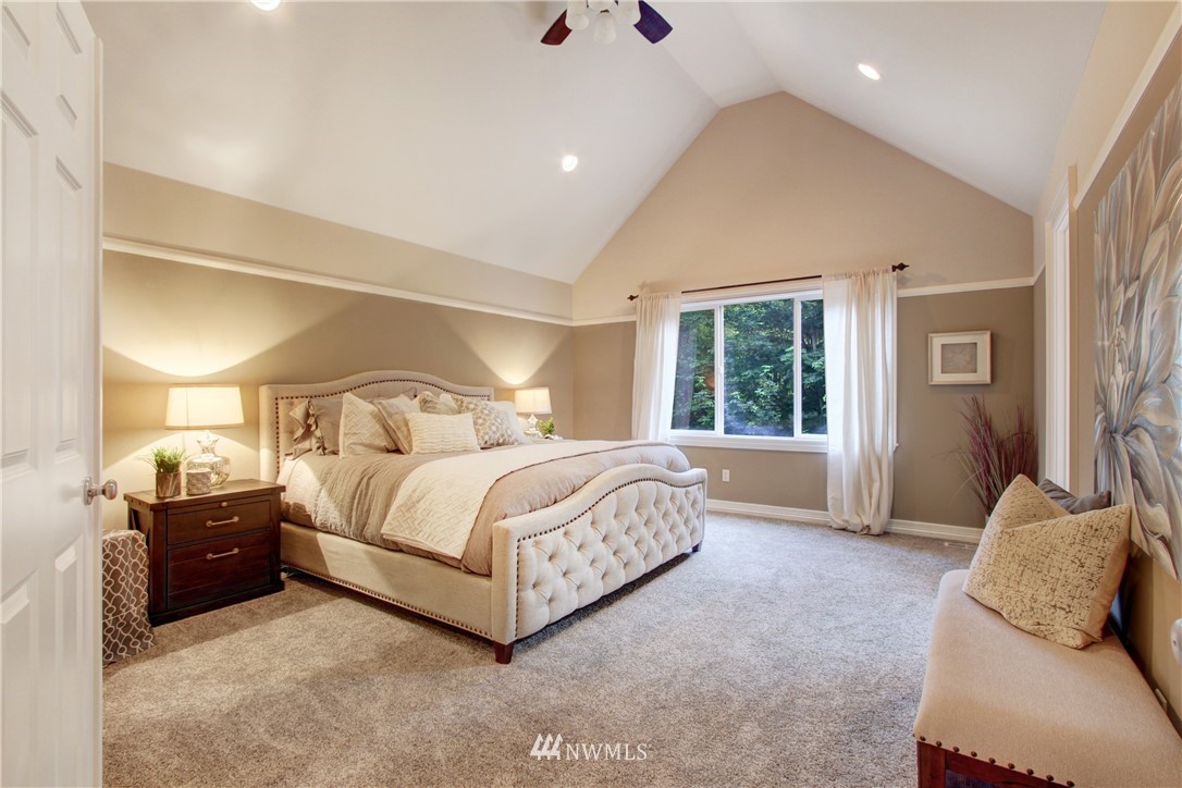 17177 Southeast Licorice Way Renton, WA 98059 - Photo 22 of 40 a spacious bedroom with a bed and window
