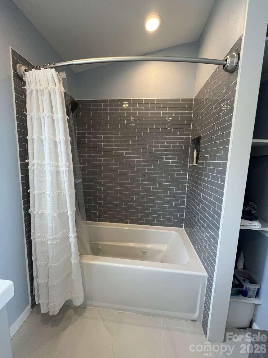 3445 Irish Hills Road Morganton, NC 28655 - Photo 24 of 34 a bathroom with a bathtub and a shower