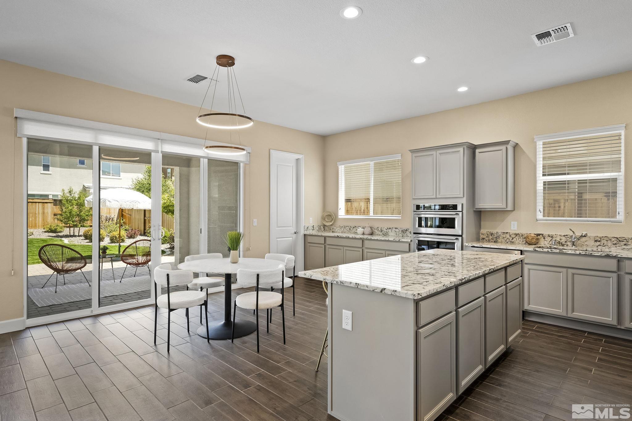 2995 Bonfire Lane Reno, NV 89521 - Photo 17 of 40 a large kitchen with kitchen island a large island in it