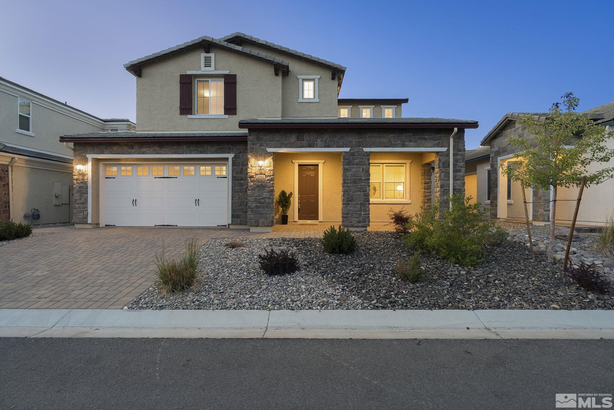 2995 Bonfire Lane Reno, NV 89521 - Photo 2 of 40 a front view of a house with garden