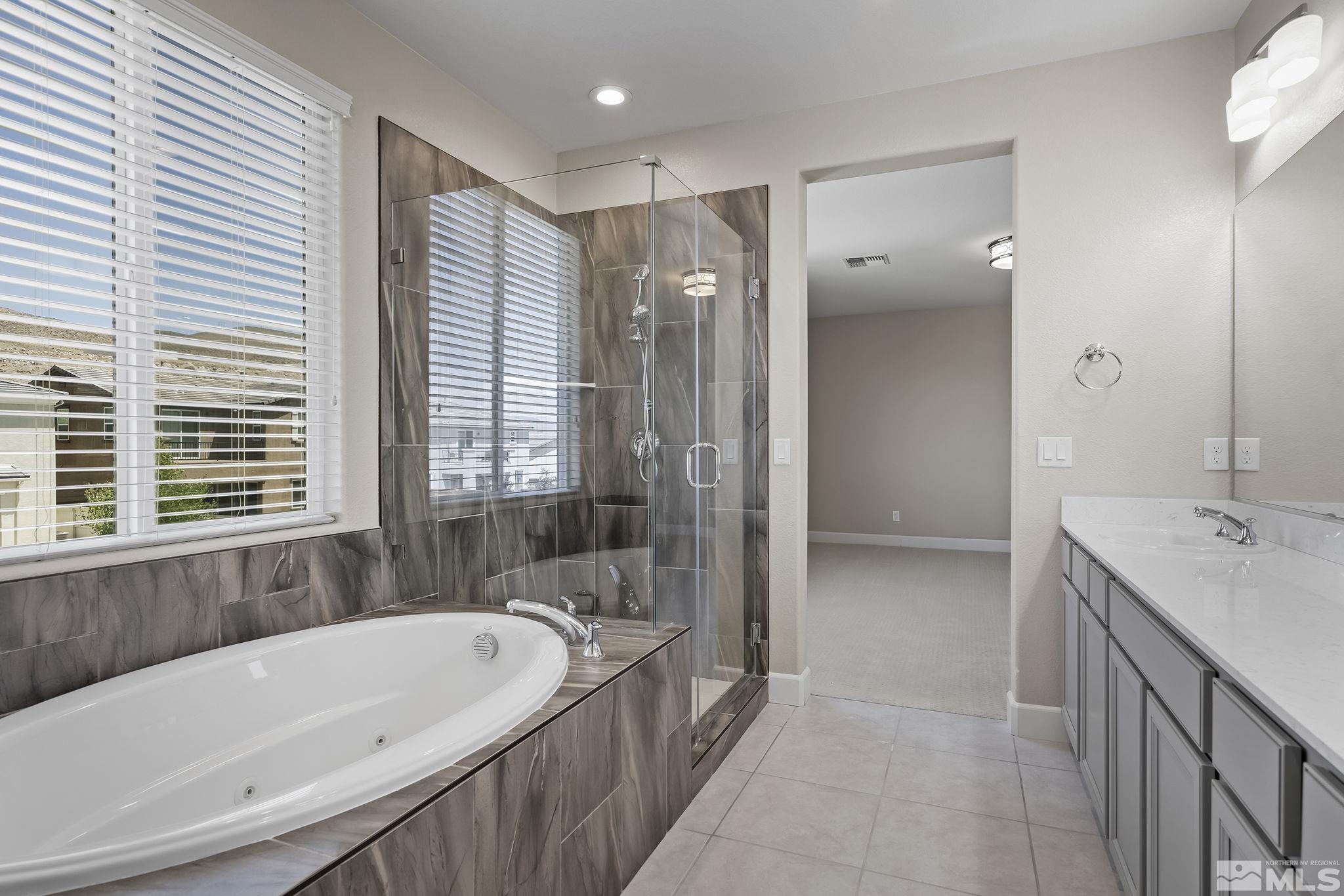 2995 Bonfire Lane Reno, NV 89521 - Photo 21 of 40 a bathroom with a bathtub and a sink