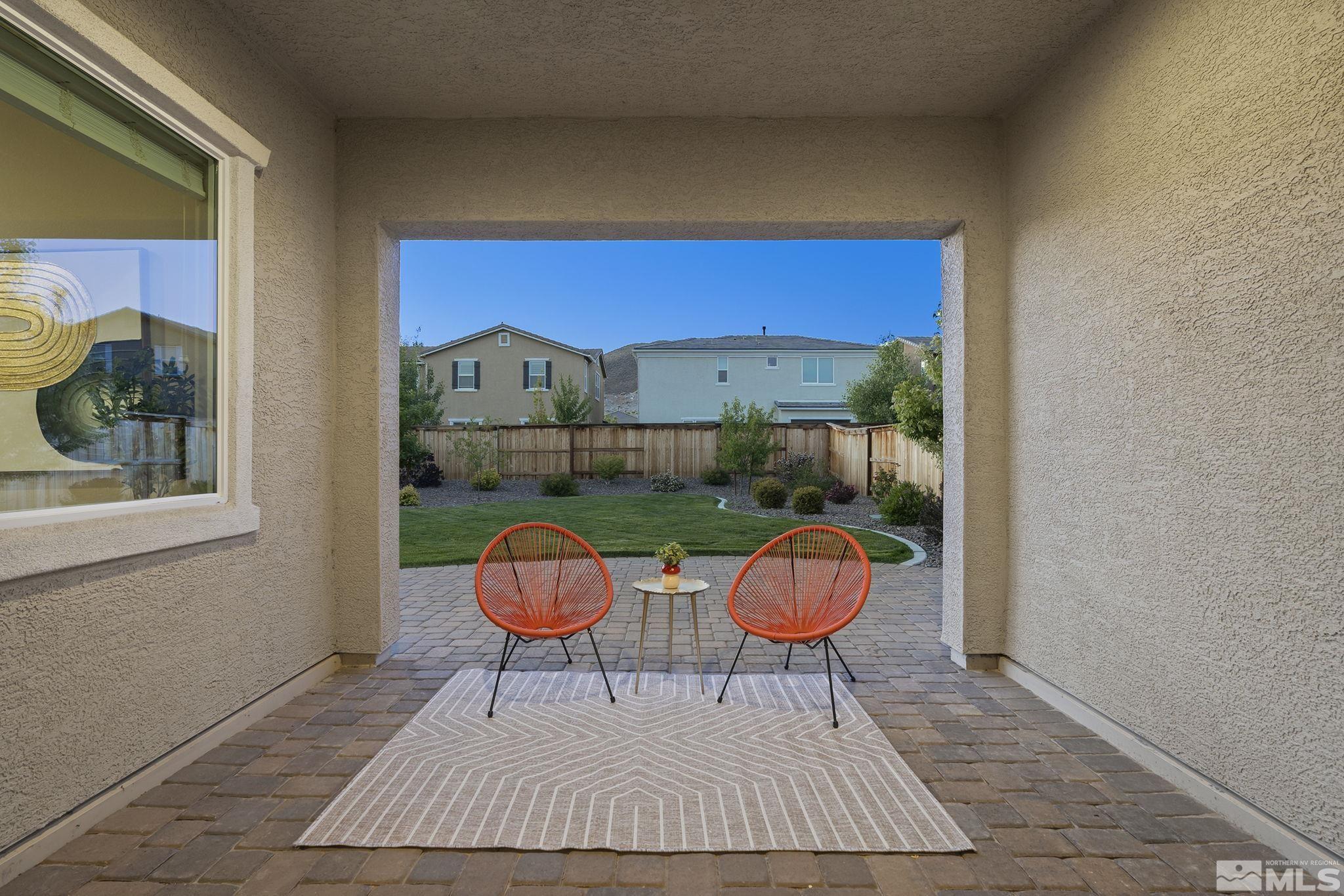 2995 Bonfire Lane Reno, NV 89521 - Photo 27 of 40 a view of an outdoor sitting area with furniture and wooden floor
