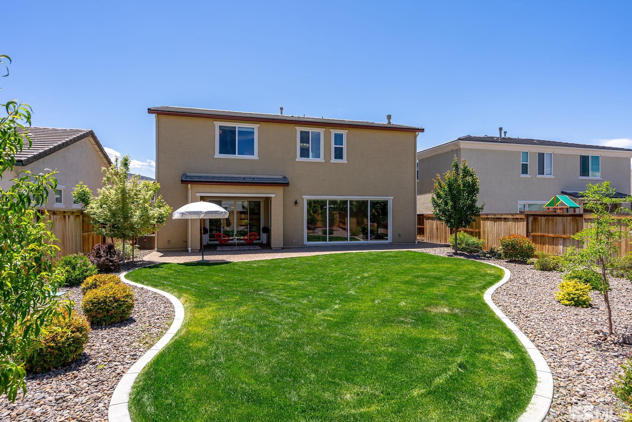 2995 Bonfire Lane Reno, NV 89521 - Photo 30 of 40 a view of a house with a yard porch and sitting area