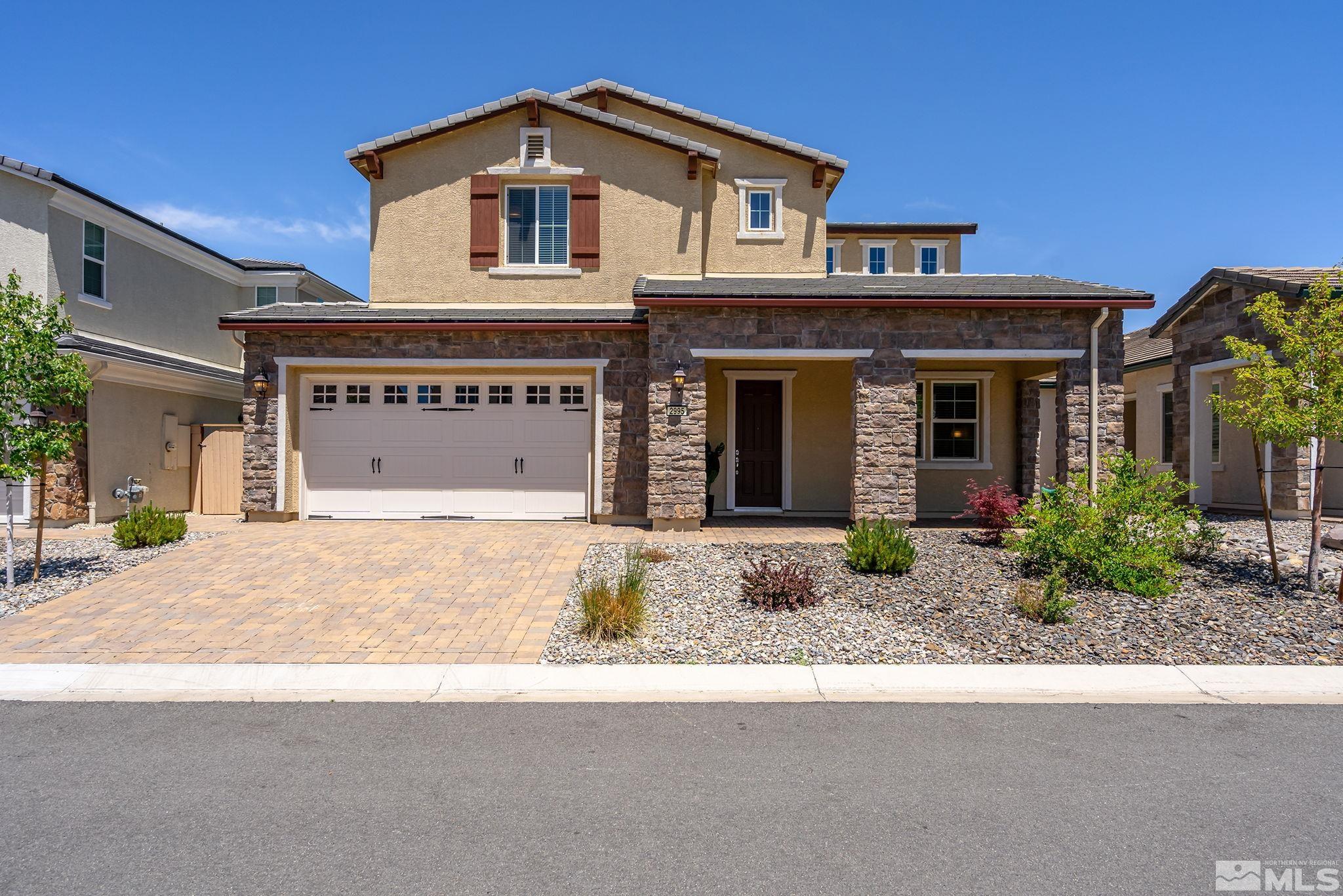 2995 Bonfire Lane Reno, NV 89521 - Photo 3 of 40 a front view of a house with garden and parking