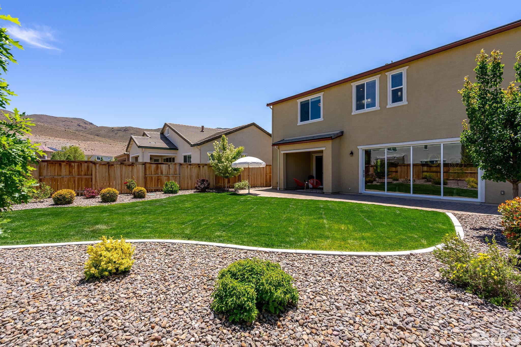 2995 Bonfire Lane Reno, NV 89521 - Photo 31 of 40 a front view of a house with a yard and porch