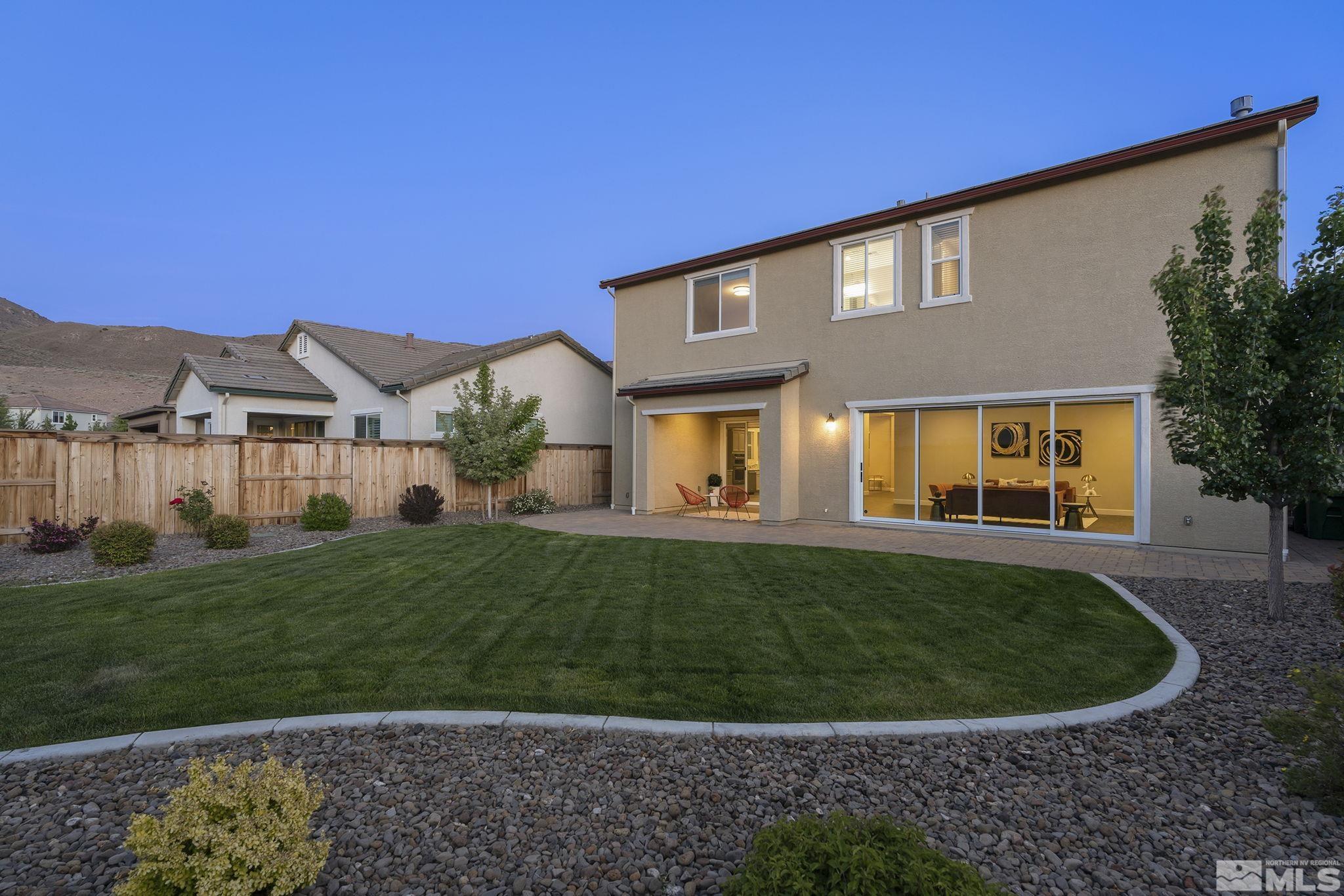 2995 Bonfire Lane Reno, NV 89521 - Photo 32 of 40 a view of a big house with a big yard and potted plants