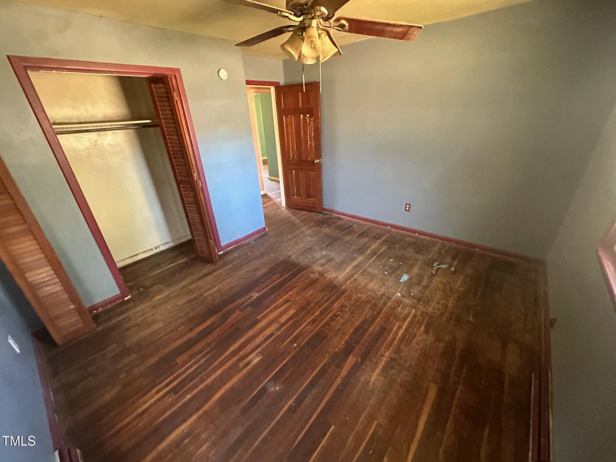 241 Cooke Circle Rich Square, NC 27869 - Photo 2 of 10 a view of empty room with wooden floor and fan