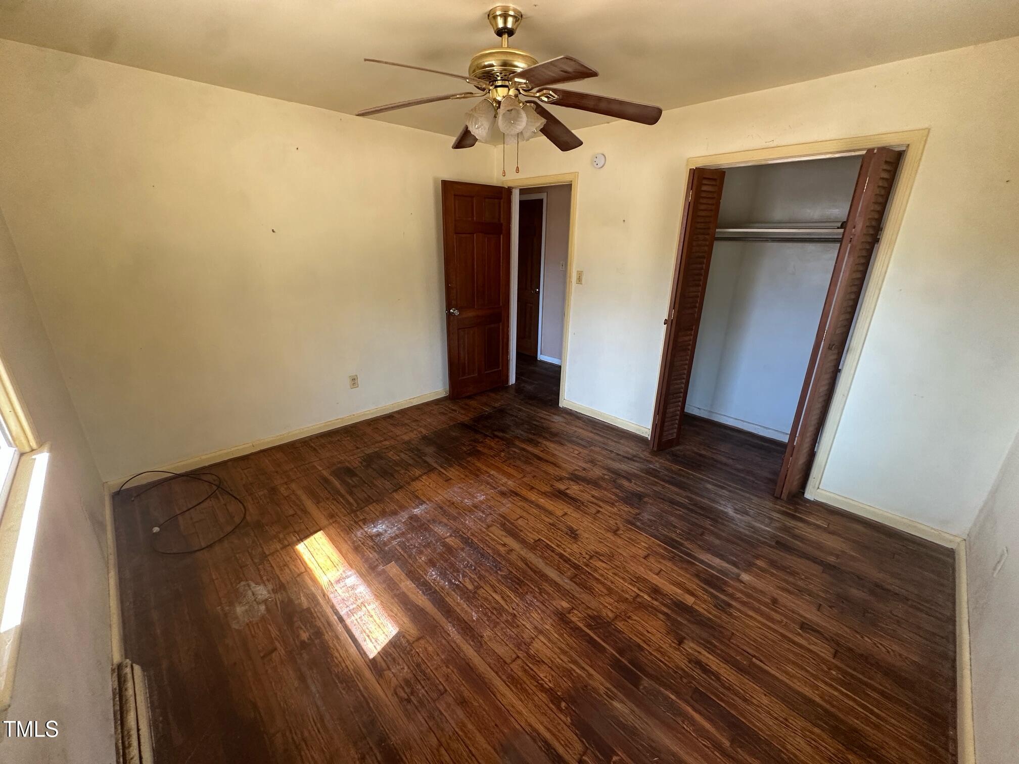241 Cooke Circle Rich Square, NC 27869 - Photo 3 of 10 a view of empty room with window and ceiling fan