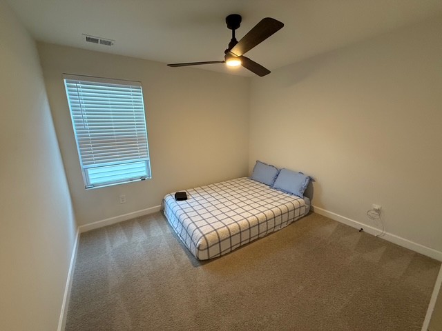 1737 Fenway Loop Antioch, TN 37013 - Photo 19 of 33 a bedroom with a bed and a window