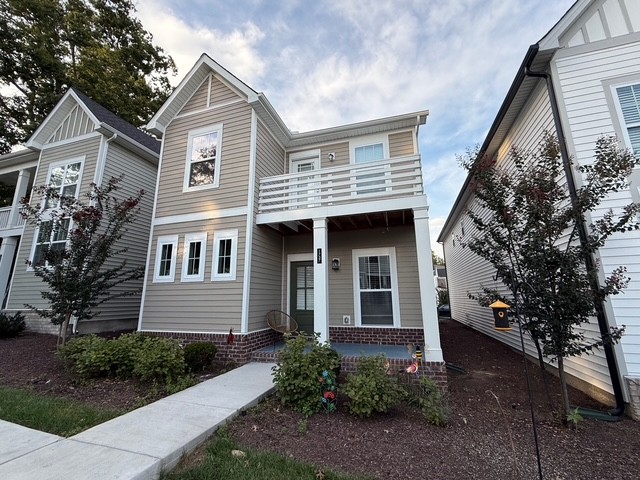 1737 Fenway Loop Antioch, TN 37013 - Photo 2 of 33 a front view of a house with a garden