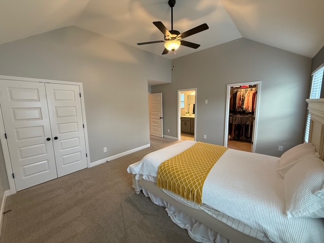 1737 Fenway Loop Antioch, TN 37013 - Photo 23 of 33 a bedroom with a large bed and a chandelier
