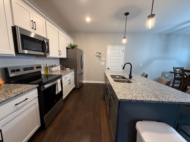 1737 Fenway Loop Antioch, TN 37013 - Photo 6 of 33 a kitchen with a sink stove and microwave