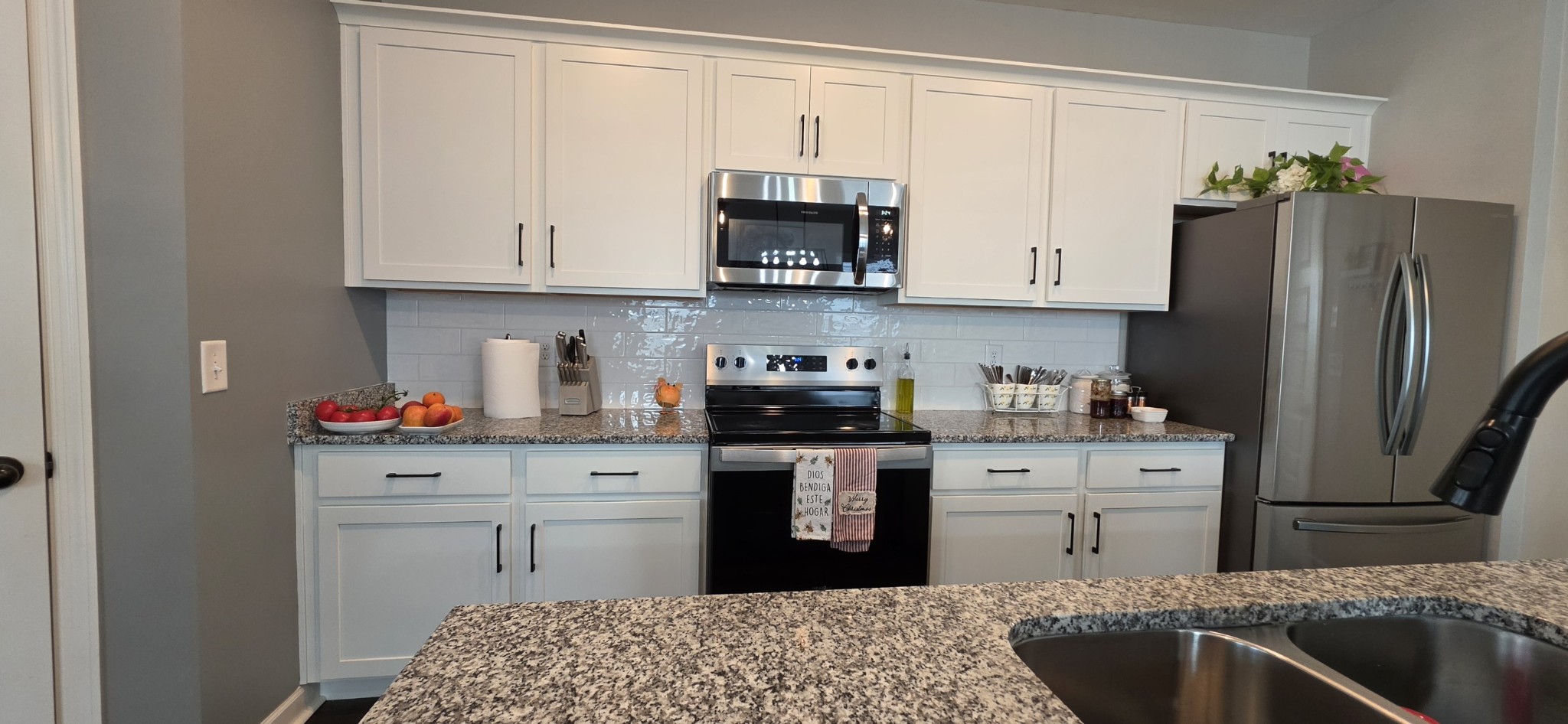 1737 Fenway Loop Antioch, TN 37013 - Photo 7 of 33 a kitchen with stainless steel appliances granite countertop a refrigerator sink and stove