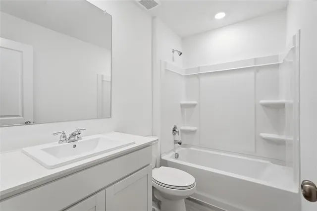 a bathroom with a sink toilet