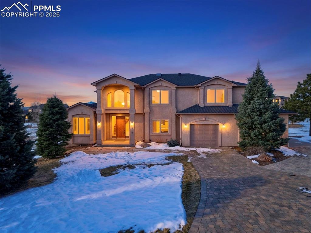 a front view of a house with a yard