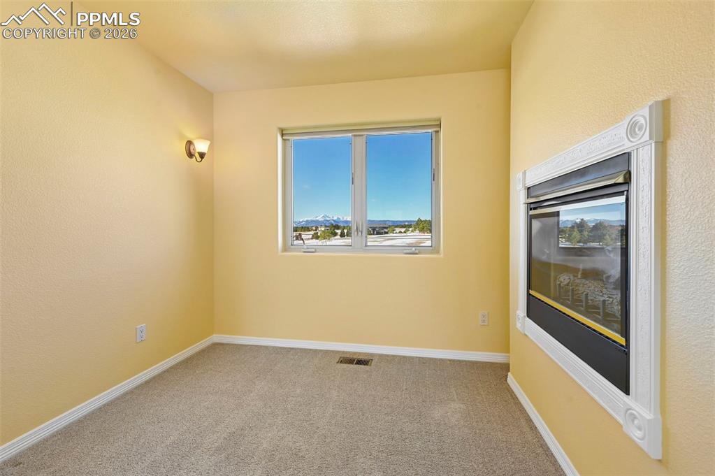 19610 Rathbone Circle Monument, CO 80132 - Photo 22 of 41 a view of an empty room with a window
