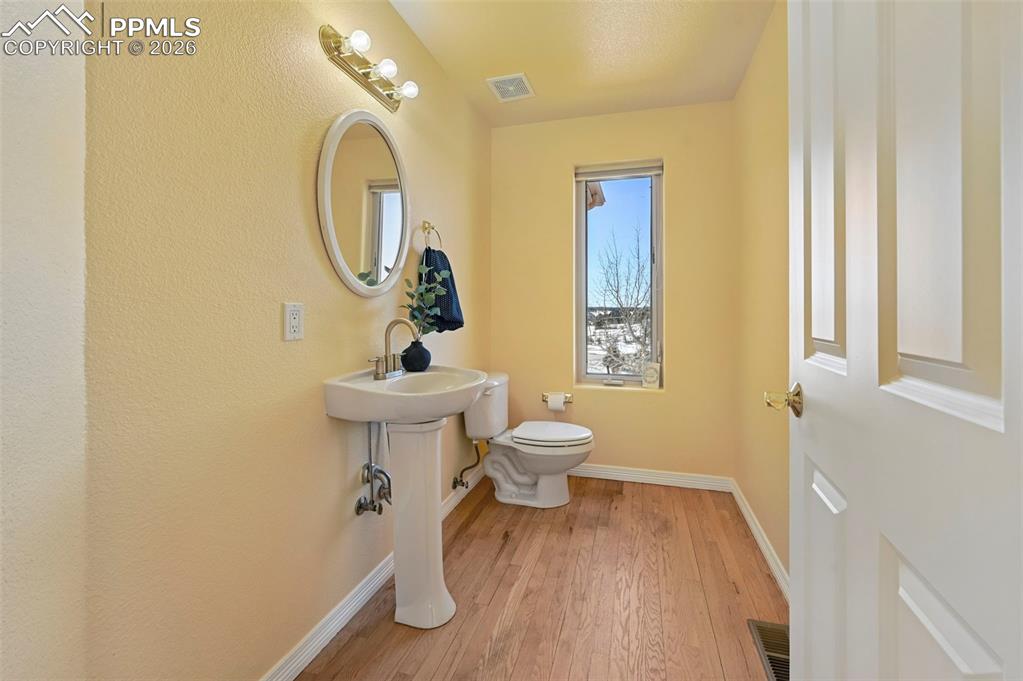 19610 Rathbone Circle Monument, CO 80132 - Photo 27 of 41 a bathroom with a toilet sink and mirror