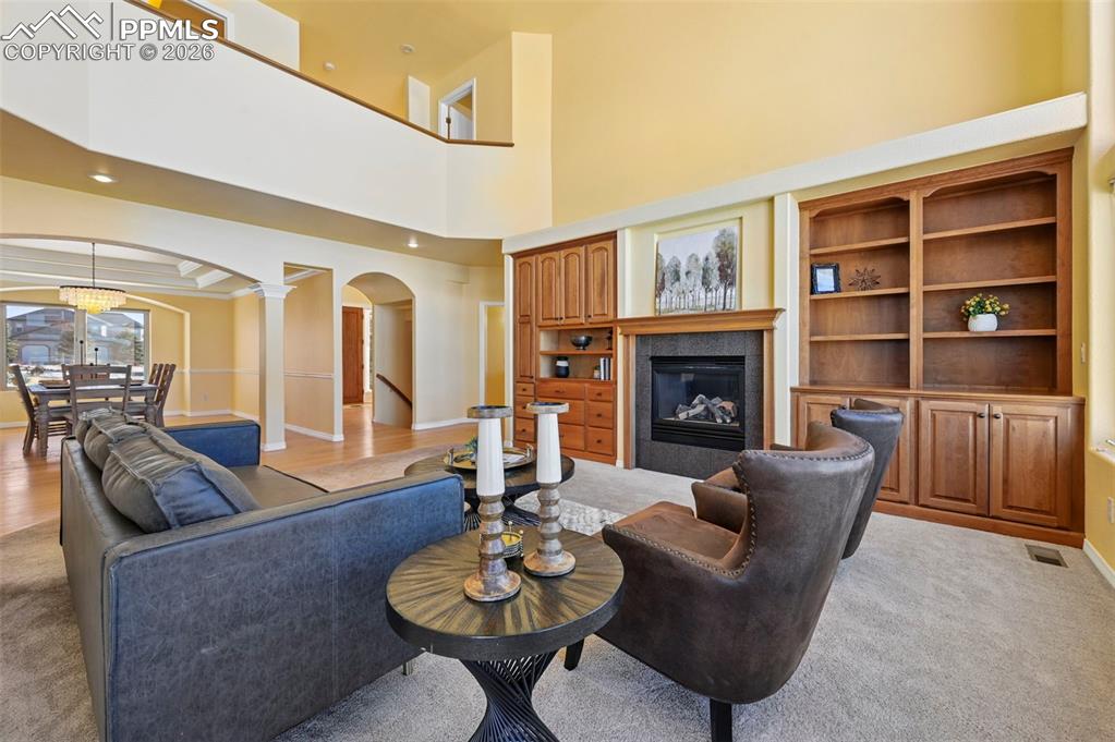 19610 Rathbone Circle Monument, CO 80132 - Photo 6 of 41 a living room with furniture kitchen view and a fireplace