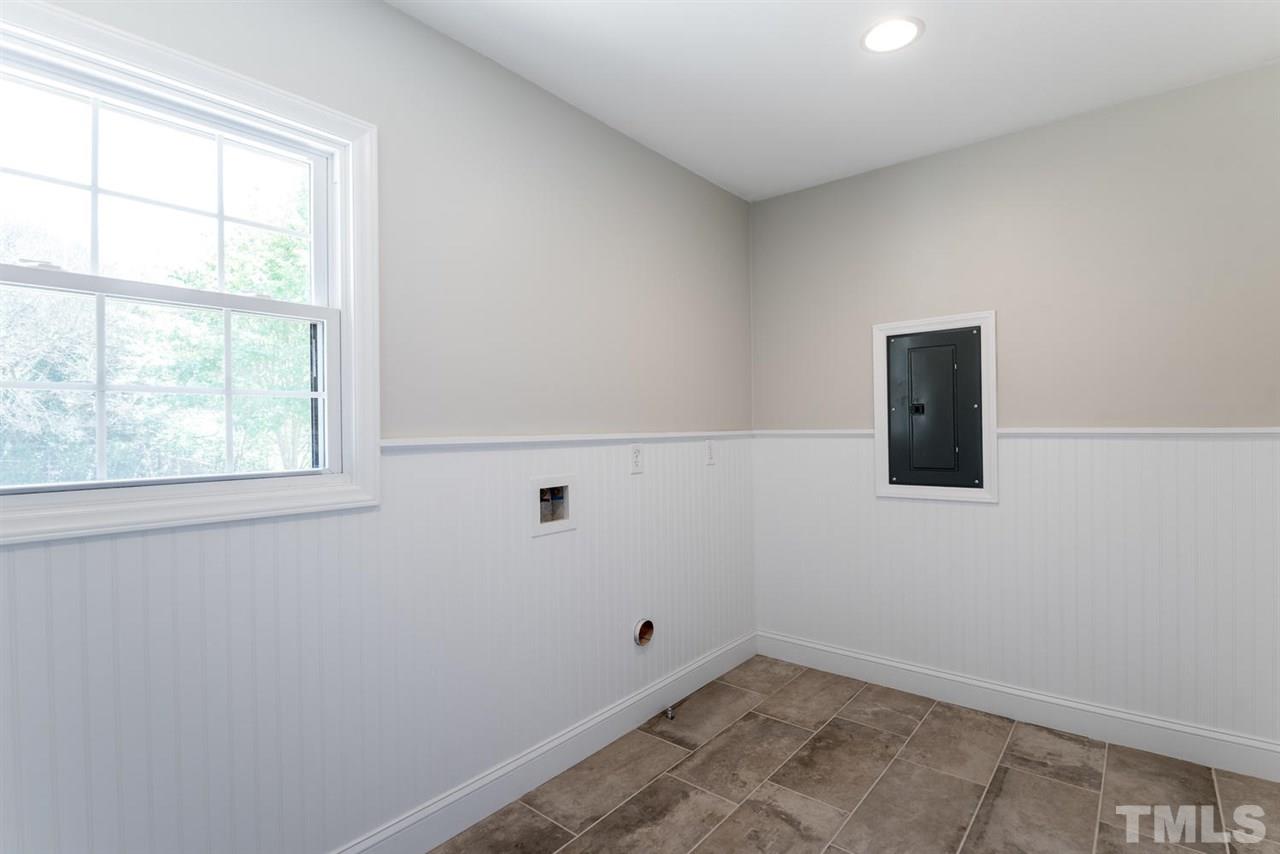3800 Bland Road Raleigh, NC 27609 - Photo 22 of 25 Conveniently located between garage and kitchen. Plenty of room for washer/dryer and all the treasures we bring into the home.