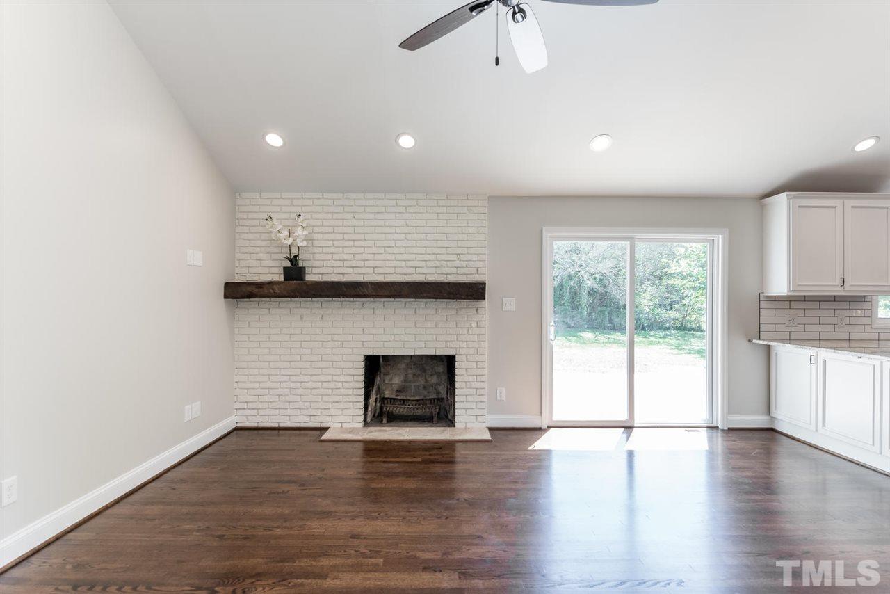 3800 Bland Road Raleigh, NC 27609 - Photo 5 of 25 Mantle is reclaimed 100 year old hardwood.