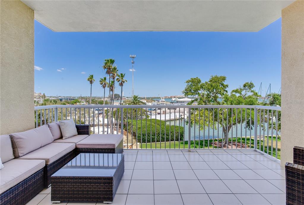 425 150th Avenue, Unit 2301 Madeira Beach, FL 33708 - Photo 15 of 67 a view of a balcony with furniture