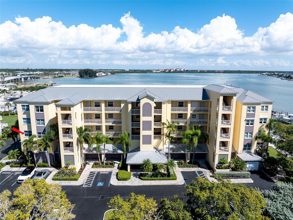 425 150th Avenue, Unit 2301 Madeira Beach, FL 33708 - Photo 2 of 67 front view of a house with a garden