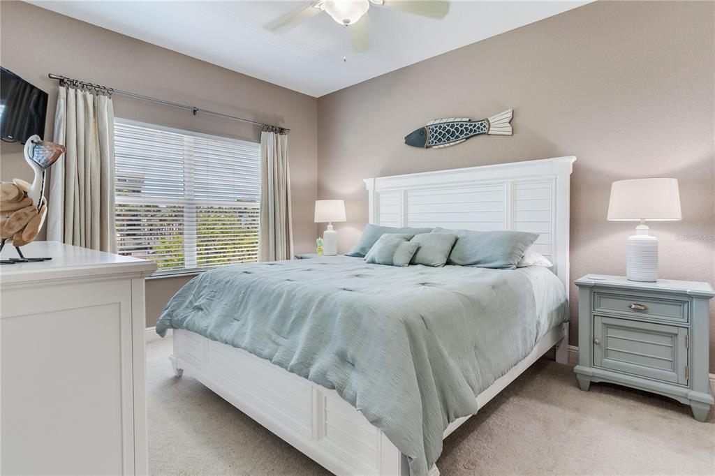 425 150th Avenue, Unit 2301 Madeira Beach, FL 33708 - Photo 36 of 67 a bedroom with a bed and a window