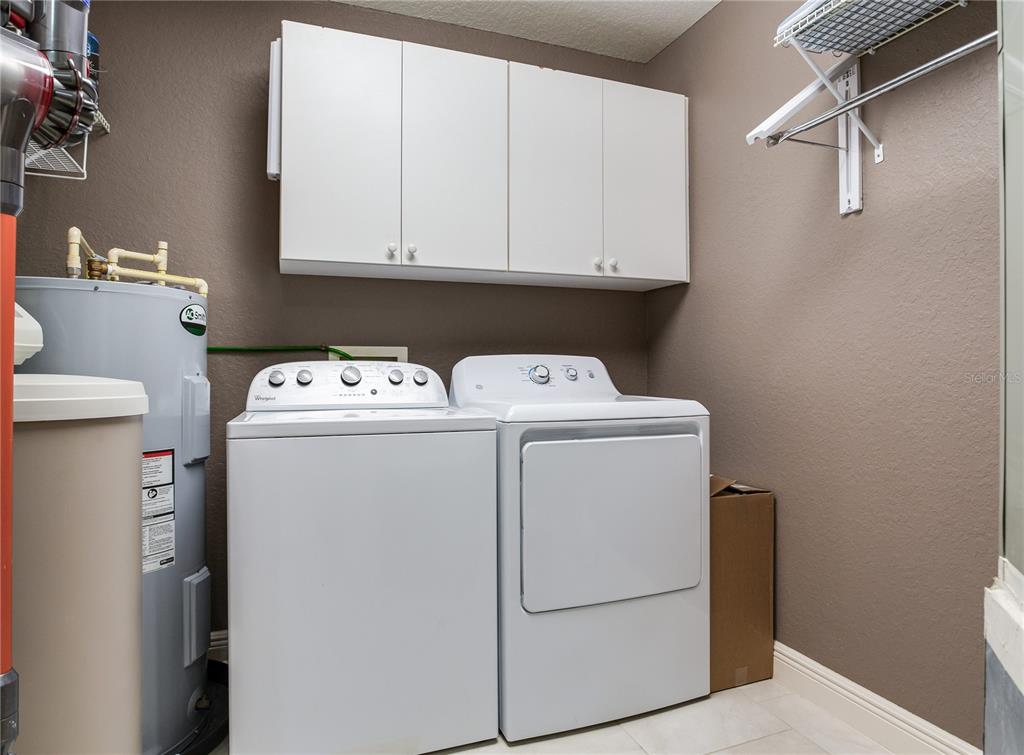 425 150th Avenue, Unit 2301 Madeira Beach, FL 33708 - Photo 41 of 67 a utility room with dryer and washer