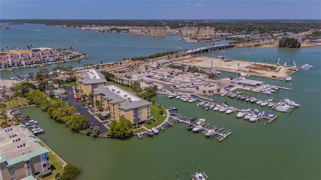 425 150th Avenue, Unit 2301 Madeira Beach, FL 33708 - Photo 46 of 67 an aerial view of a house with a lake view