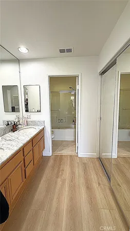 wooden floor with a window in a room