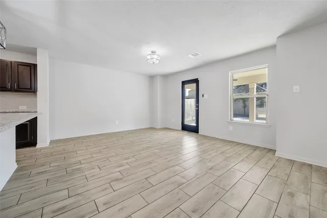 a view of an empty room with a window