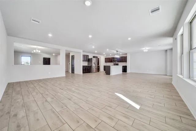 a view of empty room with windows