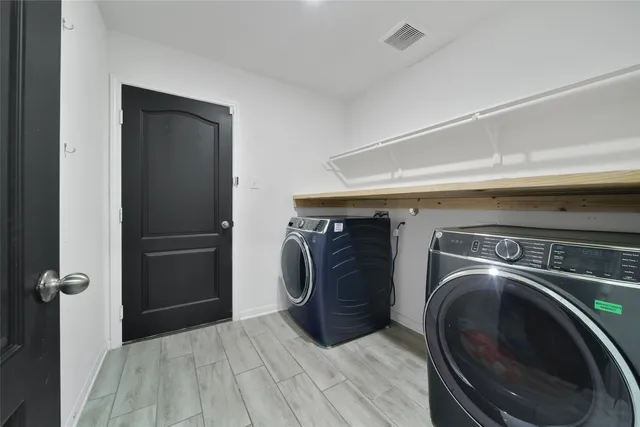 a view of a roof deck with furniture