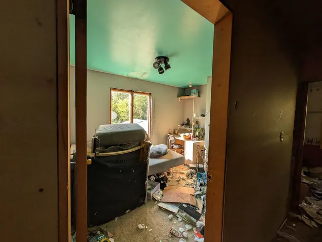 a view of a entryway door with living room