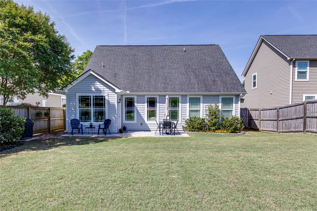 203 Streams Way Anderson, SC 29625 - Photo 42 of 47 This outdoor space features a well-maintained lawn and a comfortable patio area perfect for relaxation.
