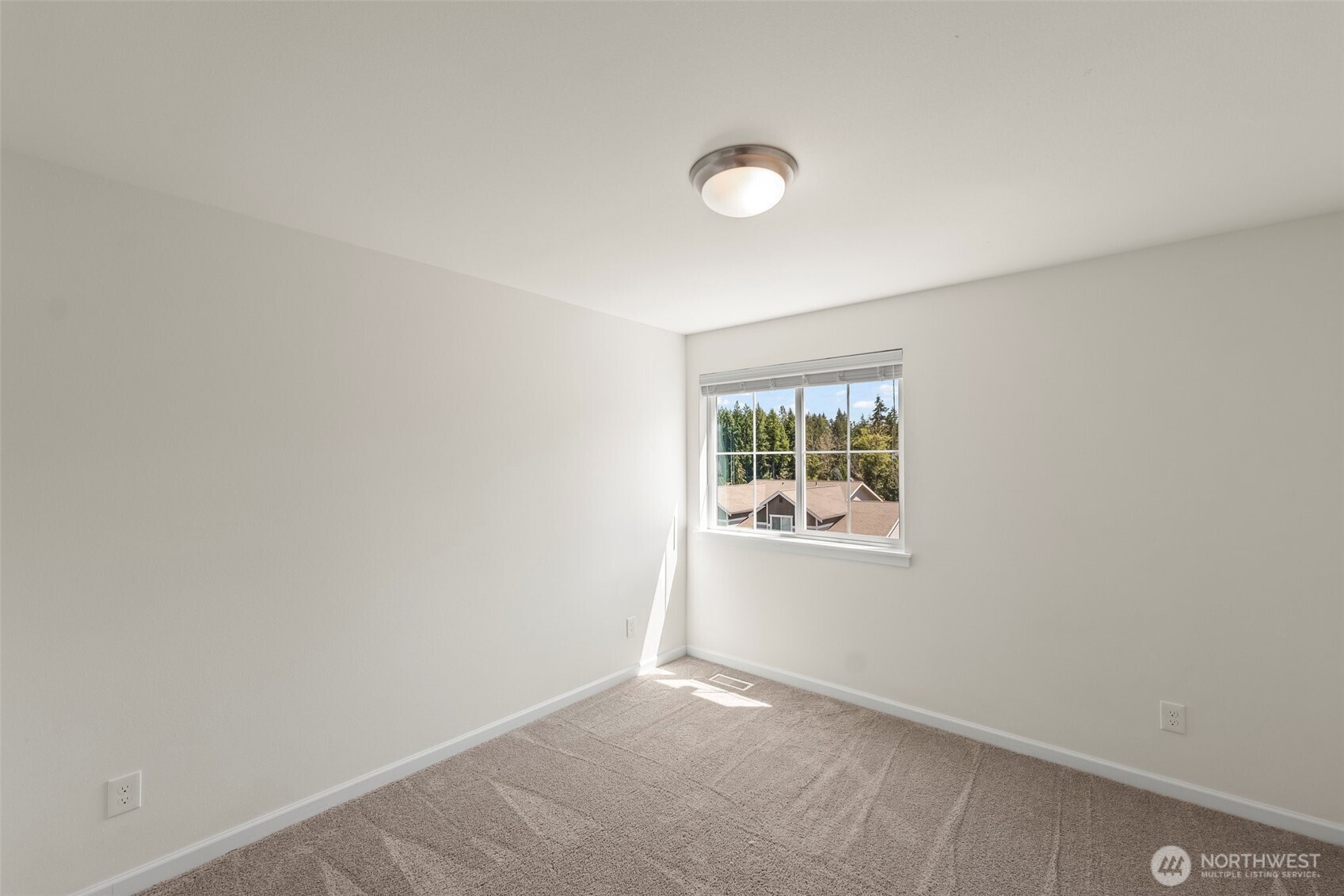 1080 East Old Ranch Road, Unit A1A2 Allyn, WA 98524 - Photo 24 of 35 an empty room with a window