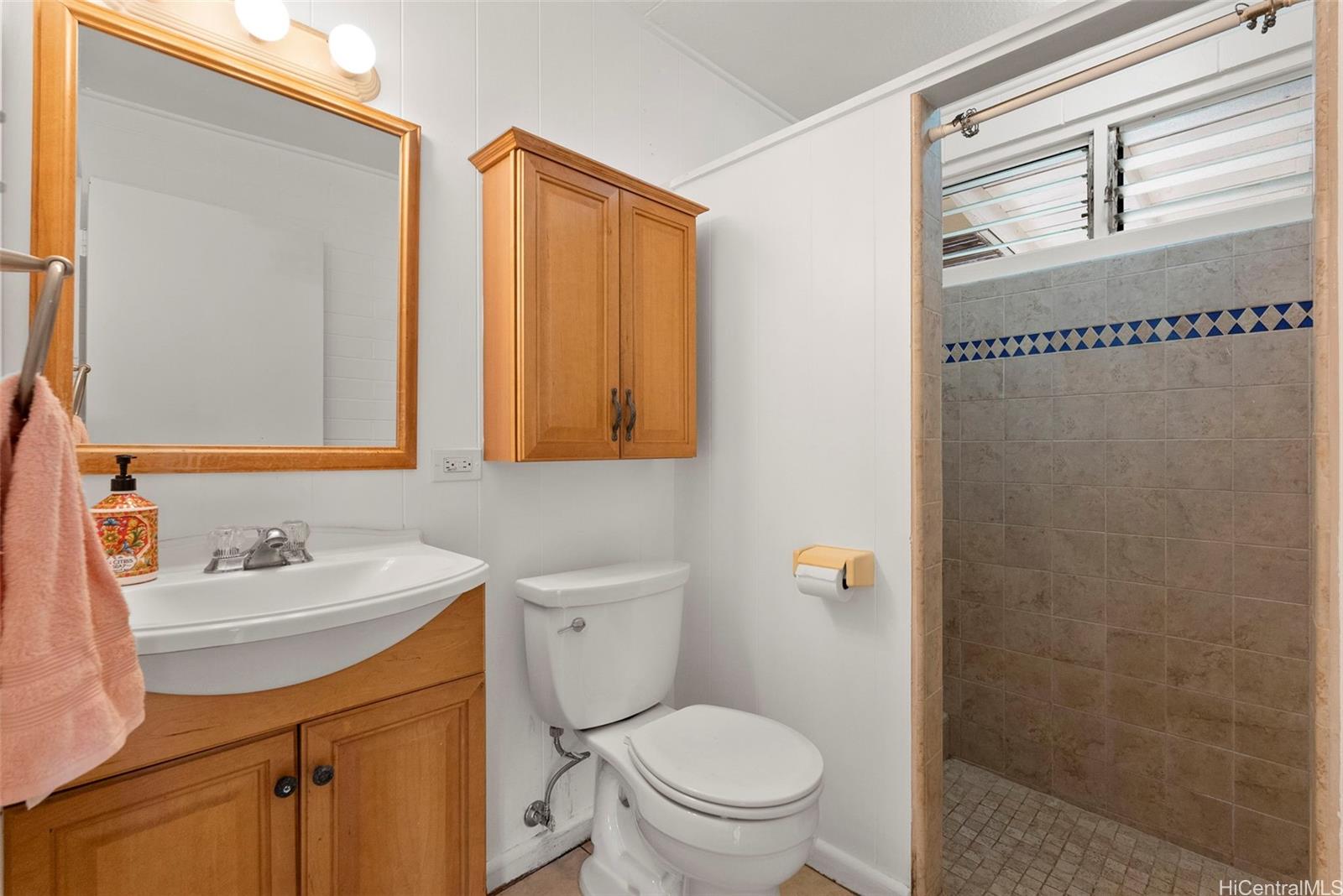 87-1087 Apuupuu Road Waianae, HI 96792 - Photo 23 of 25 a bathroom with a sink a toilet and shower