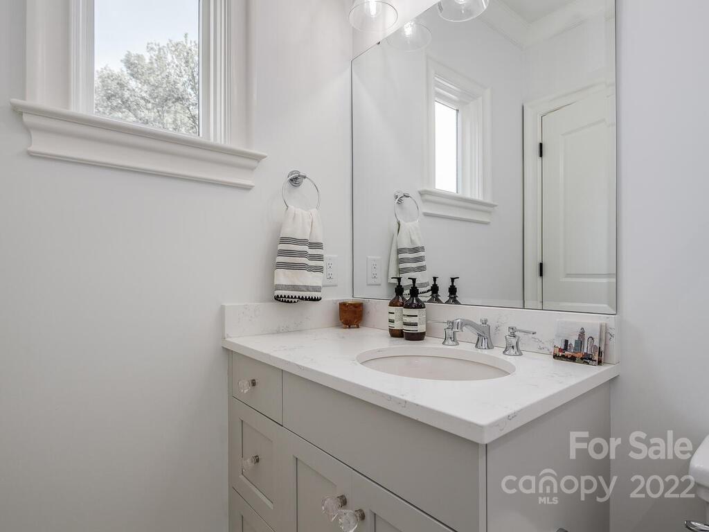3013 Manor Road Charlotte, NC 28209 - Photo 31 of 41 a bathroom with a sink and a mirror