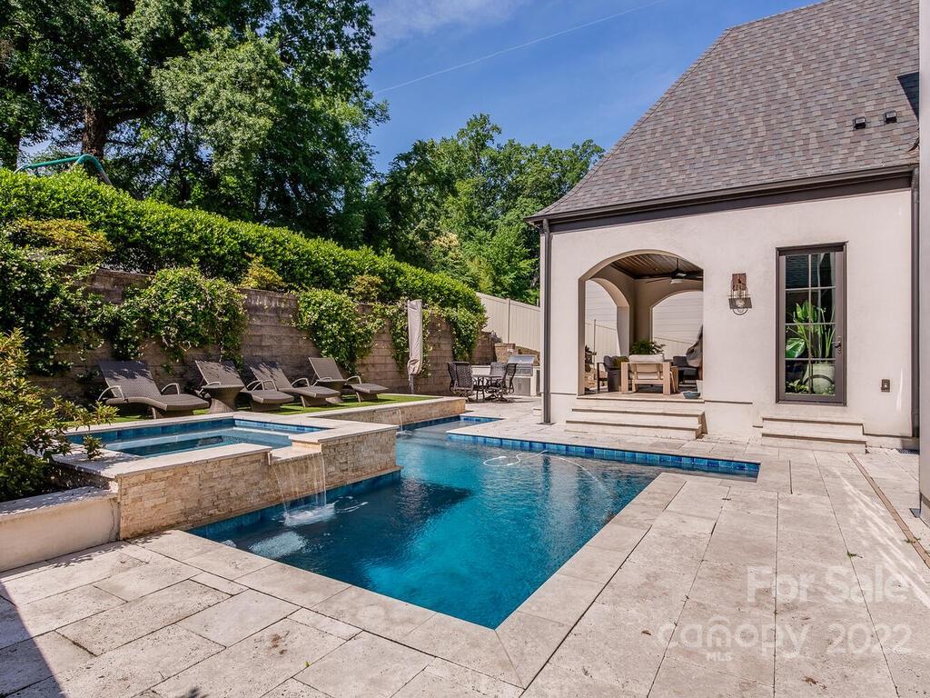 3013 Manor Road Charlotte, NC 28209 - Photo 36 of 41 a view of a swimming pool with outdoor seating