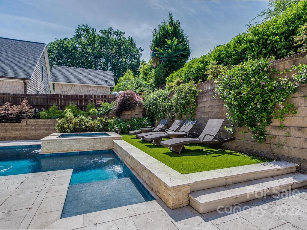 3013 Manor Road Charlotte, NC 28209 - Photo 38 of 41 a view of a chairs and table in the backyard