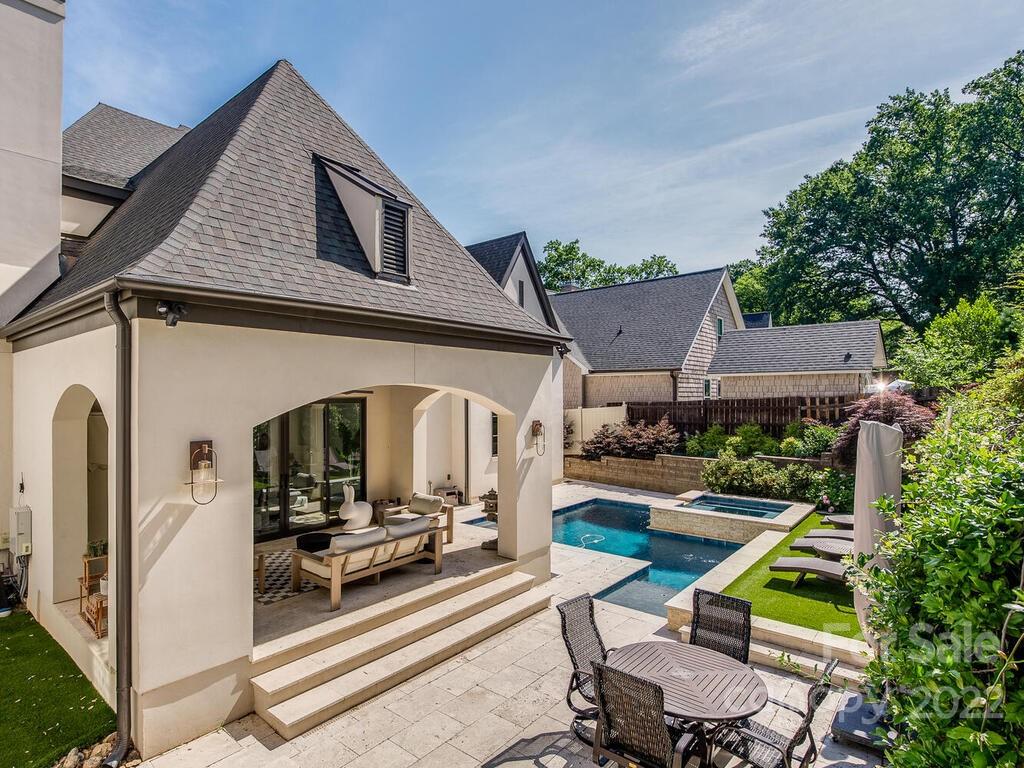 3013 Manor Road Charlotte, NC 28209 - Photo 40 of 41 a view of backyard with wheel chair potted plants and large tree