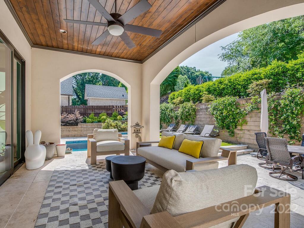 3013 Manor Road Charlotte, NC 28209 - Photo 41 of 41 a outdoor space with patio the couches and a dining table with garden view