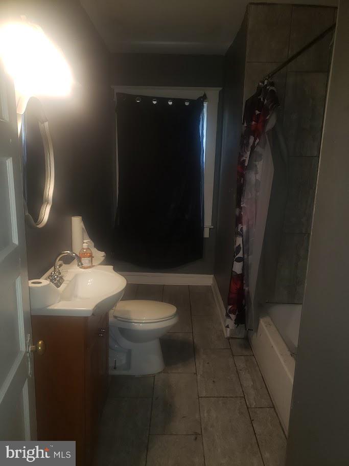 3615 Springdale Avenue Baltimore, MD 21216 - Photo 16 of 17 a bathroom with a toilet sink and shower