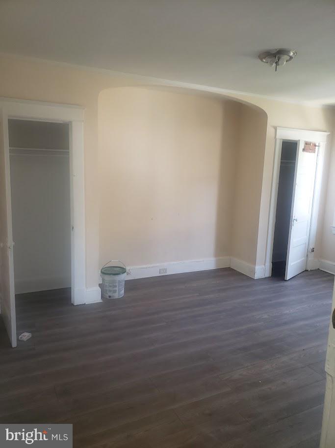 3615 Springdale Avenue Baltimore, MD 21216 - Photo 17 of 17 a view of an empty room with wooden floor and a window
