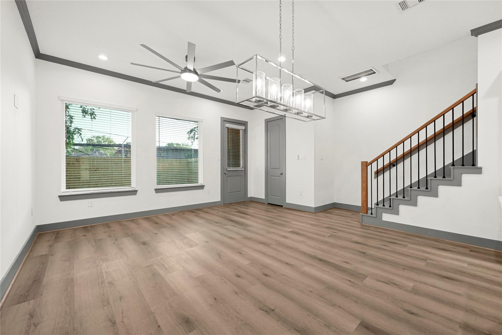 4019 Stassen Street, Unit A Houston, TX 77051 - Photo 17 of 35 a view of an empty room with wooden floor and a window