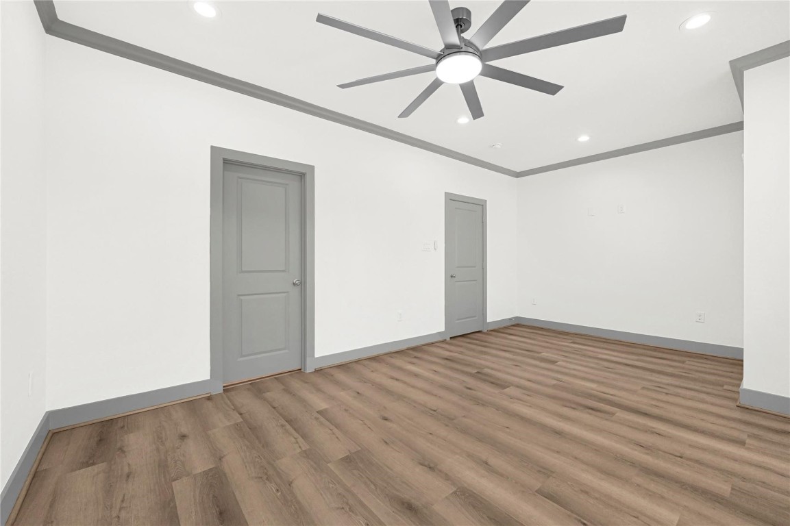 4019 Stassen Street, Unit A Houston, TX 77051 - Photo 22 of 35 A view of the primary bedroom without virtual staging, showing access to the primary bathroom and entry.