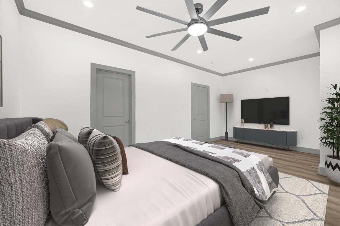 4019 Stassen Street, Unit A Houston, TX 77051 - Photo 23 of 35 a bedroom with a bed and a flat screen tv